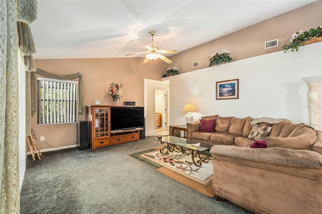 living room with lofted ceiling, visible vents, ceiling fan, and dark colored carpet