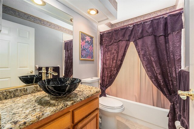 full bath with vanity, shower / bath combo, tile patterned flooring, and toilet