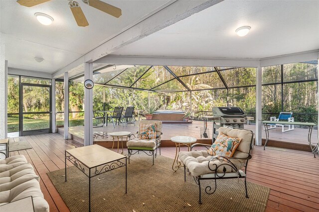 sunroom featuring a ceiling fan