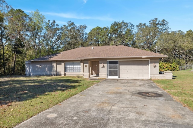 ranch-style home with stucco siding, a front yard, driveway, and a garage