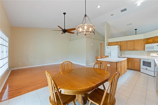 dining room with light tile patterned floors, high vaulted ceiling, a ceiling fan, visible vents, and baseboards