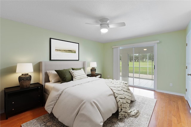 bedroom with light wood finished floors, baseboards, a ceiling fan, access to outside, and a textured ceiling