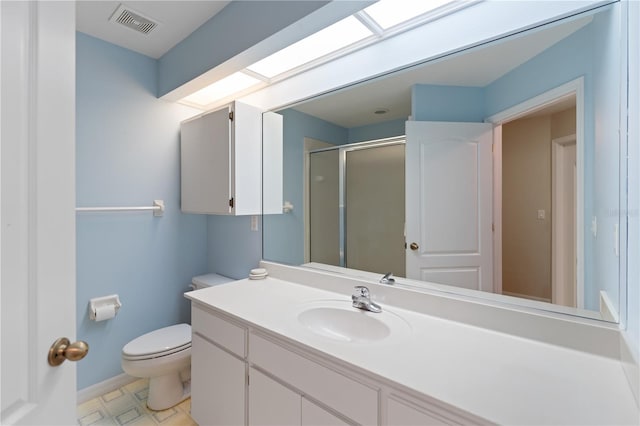 bathroom with visible vents, baseboards, toilet, vanity, and a shower stall