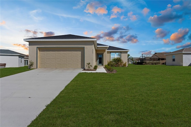 ranch-style home with an attached garage, concrete driveway, a front yard, and stucco siding