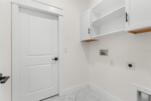 clothes washing area with hookup for a washing machine, hookup for an electric dryer, baseboards, marble finish floor, and cabinet space