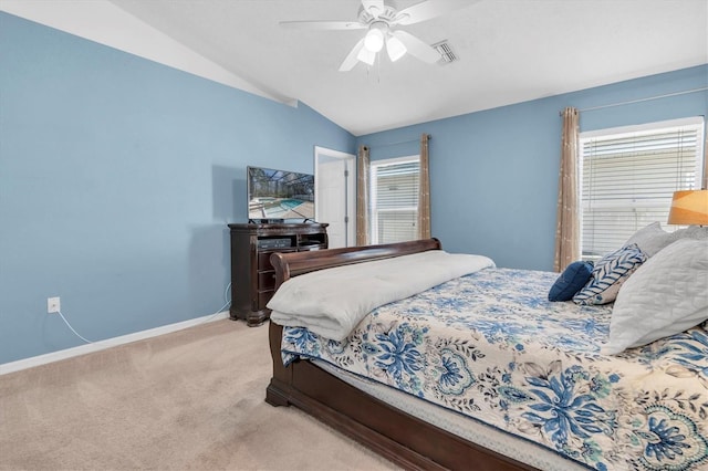 bedroom featuring visible vents, baseboards, a ceiling fan, carpet, and vaulted ceiling