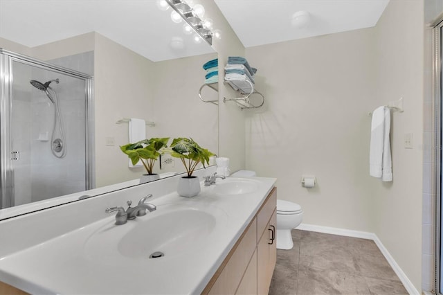 bathroom featuring a sink, a shower stall, and baseboards