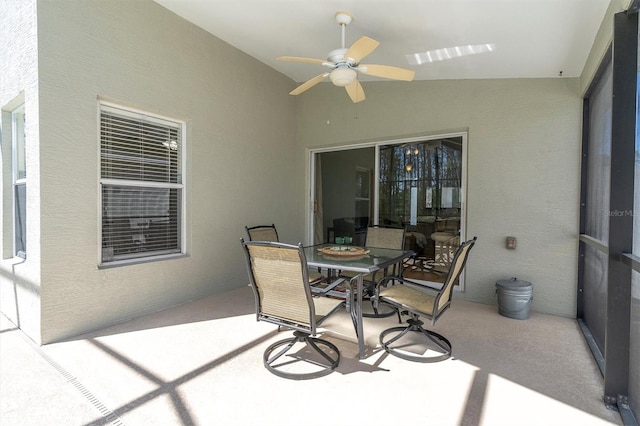 view of patio / terrace featuring outdoor dining space and a ceiling fan