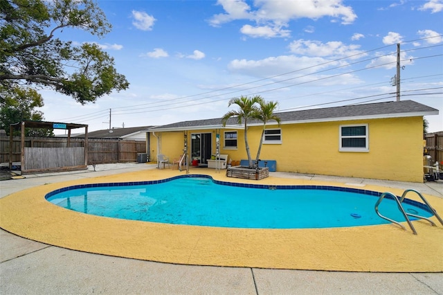 view of pool featuring a patio area, a fenced backyard, and a fenced in pool