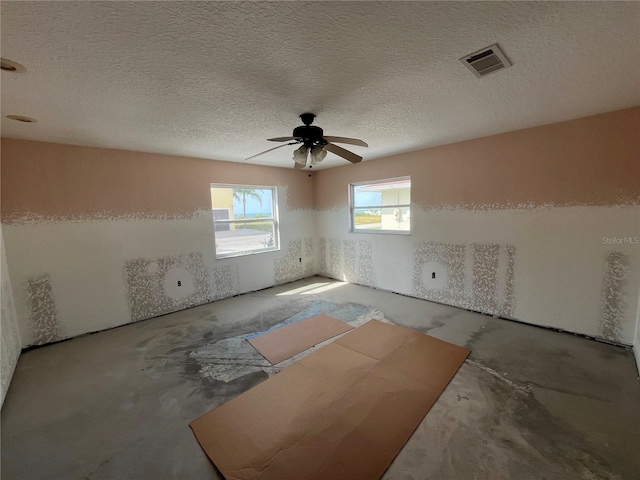 6228 Lonnie Lee Ln, Hudson, FL 34667 - empty room with a ceiling fan and a textured ceiling