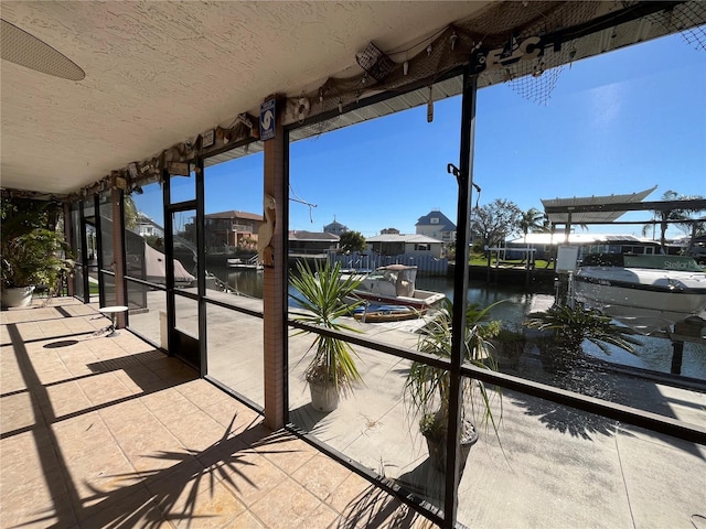 6228 Lonnie Lee Ln, Hudson, FL 34667 - unfurnished sunroom featuring a water view and a residential view