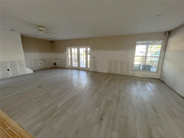 6228 Lonnie Lee Ln, Hudson, FL 34667 - unfurnished living room with wood finished floors and ceiling fan