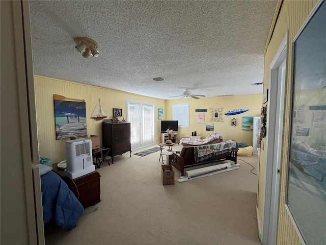 6228 Lonnie Lee Ln, Hudson, FL 34667 - bedroom with carpet, a textured ceiling, and ceiling fan