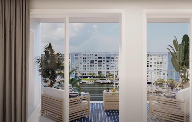 doorway to outside featuring a view of city and a water view