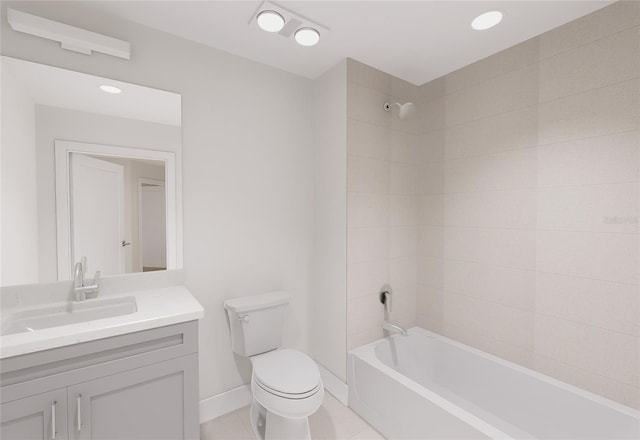 bathroom featuring baseboards, toilet,  shower combination, tile patterned flooring, and vanity