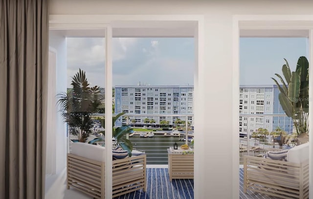 entryway featuring a water view and a city view