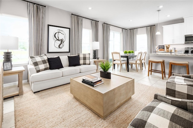 living room featuring light tile patterned floors and recessed lighting