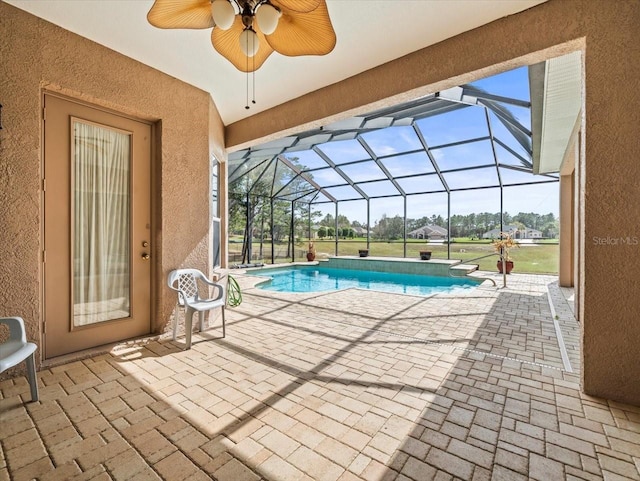 outdoor pool with a patio area and a lanai