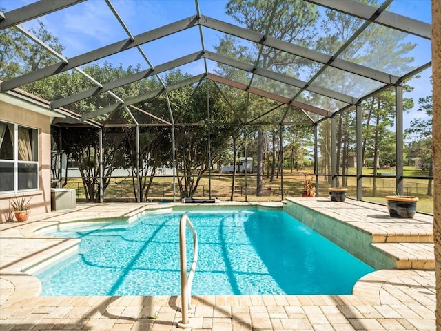 pool with a patio area and a lanai