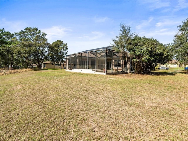 view of yard with glass enclosure