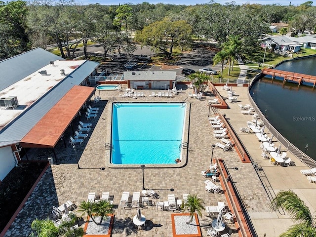 view of swimming pool featuring a water view