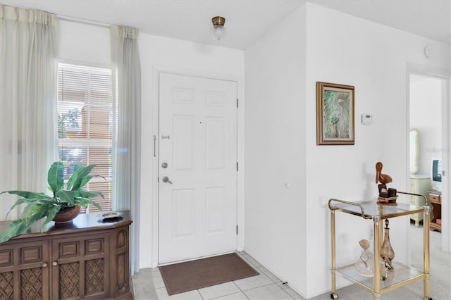 entryway featuring light tile patterned flooring