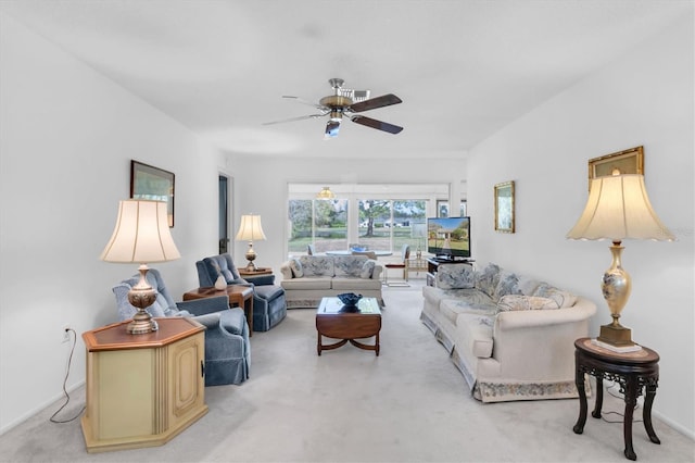 living area featuring light carpet, ceiling fan, visible vents, and baseboards