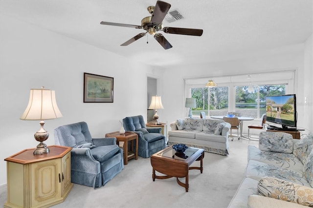 living room with light carpet and ceiling fan