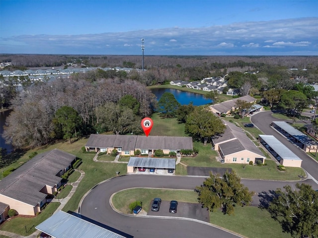 birds eye view of property featuring a water view and a residential view