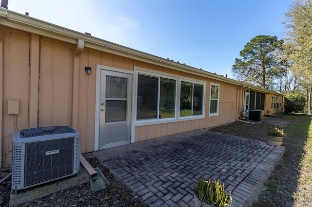 back of house with a patio area and cooling unit