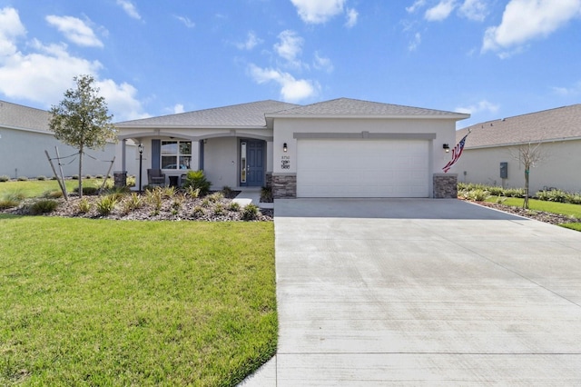 ranch-style home featuring a garage, stone siding, driveway, stucco siding, and a front lawn