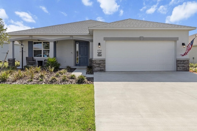 ranch-style house featuring stucco siding, concrete driveway, an attached garage, stone siding, and a front lawn