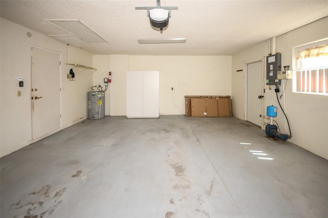 garage with electric panel, electric water heater, and a garage door opener