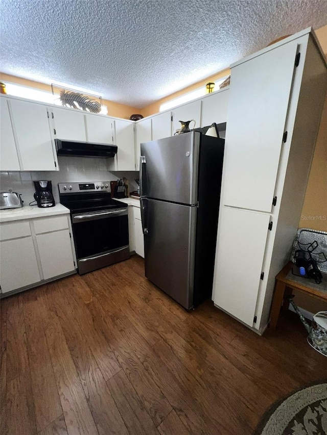 kitchen featuring stainless steel appliances, light countertops, and white cabinetry