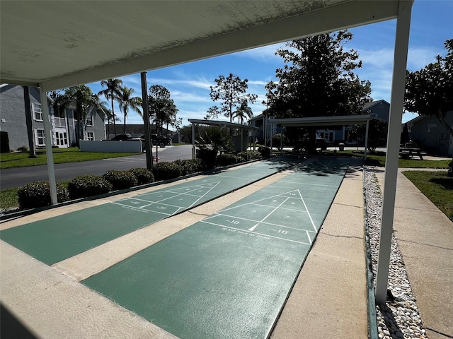 view of property's community with shuffleboard