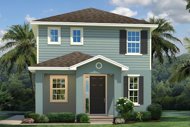 view of front of home featuring roof with shingles and stucco siding