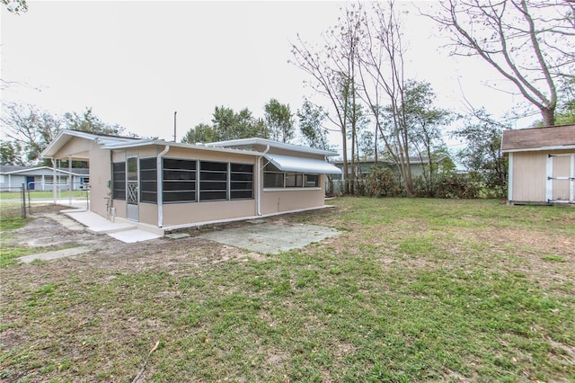 view of yard featuring fence and a sunroom