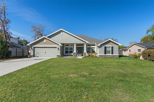 view of front facade with a garage, driveway, a front lawn, and fence