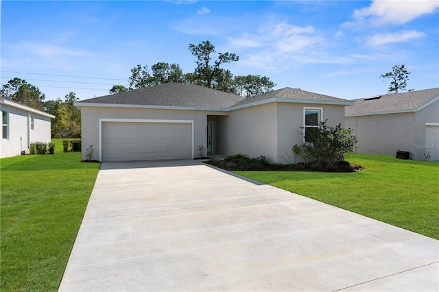 ranch-style home with a garage, concrete driveway, roof with shingles, a front lawn, and stucco siding