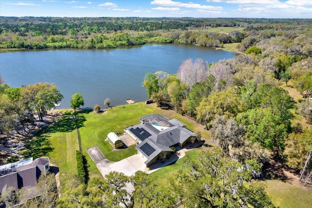 bird's eye view with a forest view and a water view