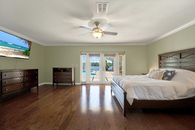 bedroom featuring visible vents, ornamental molding, access to outside, wood finished floors, and french doors