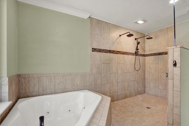 bathroom with ornamental molding, a whirlpool tub, and tiled shower