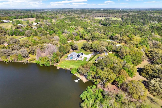 aerial view with a forest view and a water view