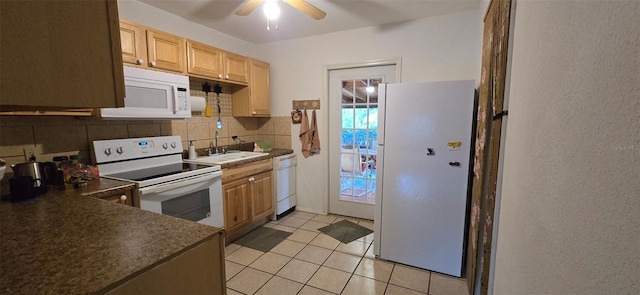 kitchen with light brown cabinets, a sink, tasteful backsplash, white appliances, and light tile patterned floors