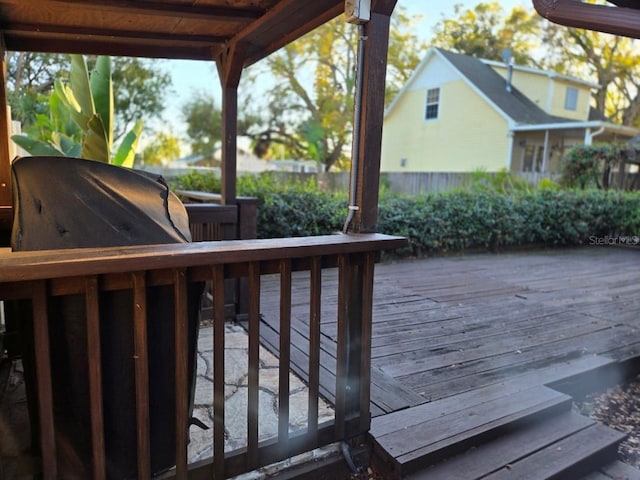 wooden terrace featuring grilling area