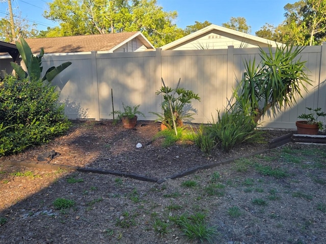 view of side of property featuring a fenced backyard