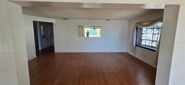 empty room featuring dark wood-type flooring