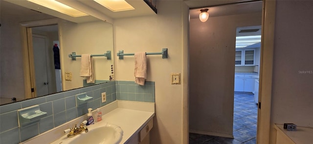 bathroom with tile patterned floors, backsplash, and vanity