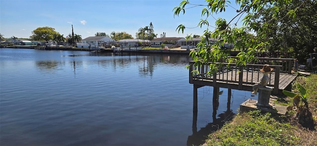 view of dock featuring a residential view and a water view