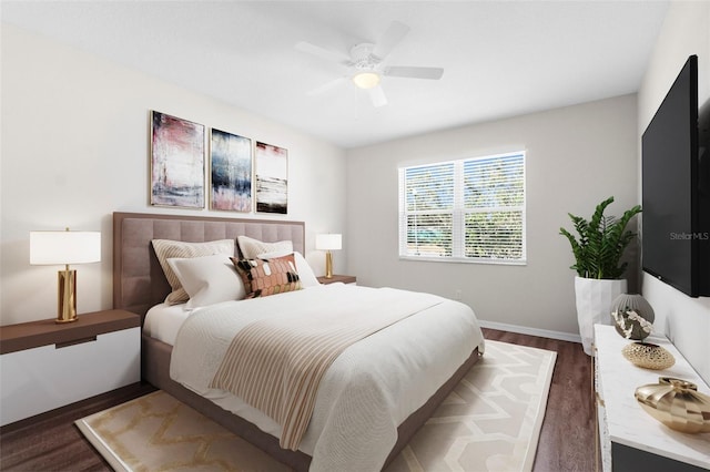 bedroom featuring ceiling fan, dark wood-type flooring, and baseboards